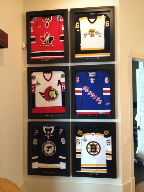 hockey jersey display Display Hockey Jersey, Hockey Jersey Wall Display, Sport Jersey Display Ideas, Old Hockey Jersey Ideas, Hockey Jersey Display Ideas, Framed Hockey Jersey, Hockey Memorabilia Display, Jersey Frame Ideas, Jersey Wall Display