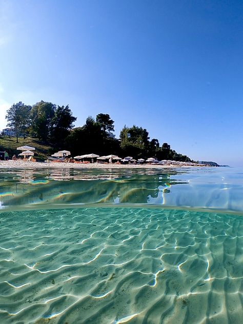 So clear water. Agora Beach, Halkidiki, Greece Halkidiki Greece Beach, Sea View Restaurant, Greek Hotels, Greece Water, Greece Halkidiki, Authentic Greek Food, Beach Beds, Water Cocktails, Greece Girl