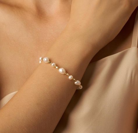 ITEM DETAILS -Bracelet Length: Small (17.5cm),  Medium (18.5cm),  Large(19.5cm) -Bead size: Freshwater pearl :8mm/5mm/2.5mm, Gold Beaded: 2mm -Clasp: Magnetic buckle with safety chain -Material: 14K Gold Plated --------------------------------- SHOW YOUR STYLE - SOPHISTICATION: The classic freshwater pearl bracelet delivers an elegant look to you and the ones near you.  - PERFECT GIFT:  Surprise your loved ones with this high quality beauty. It is also ideal for Wedding gifts, Mother's day gifts Bridesmaid Pearl Bracelet, Bridal Jewelry Pearl Sets, Pearl Bracelet Wedding, Wedding Bridesmaid Jewelry, Bracelet Wedding, Pearl Jewelry Sets, Jewelry Bridesmaid, Bracelet Dainty, Dainty Bracelet