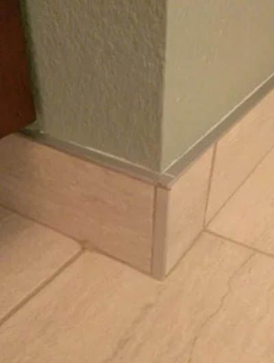 Tile Edge Trim Ideas | Sebring Design Build Wall Edging Ideas, Bathroom Floor Trim Ideas, Bathroom Tile Trim Ideas, Bathroom Floor Trim, Tile Baseboard Ideas, Tile Edging Trim Ideas Bathroom, Bathroom Tile Baseboard, Tile Trim In Bathroom, Tile Edge Trim Ideas