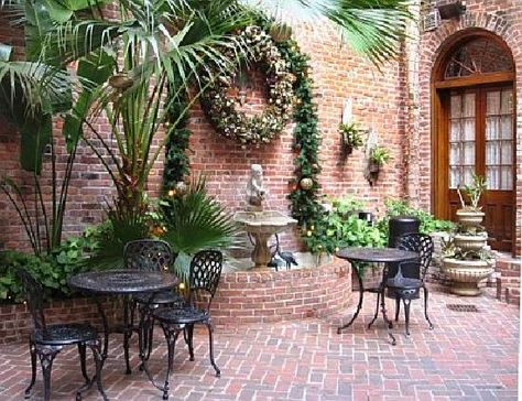 New Orleans style patio garden with lion head wall fountain. Description from pinterest.com. I searched for this on bing.com/images New Orleans Gardens Courtyards, New Orleans Courtyard, French Quarter Decor, French Courtyard, Brick Courtyard, New Orleans Architecture, Court Yard, Small Courtyard Gardens, Courtyard Gardens Design