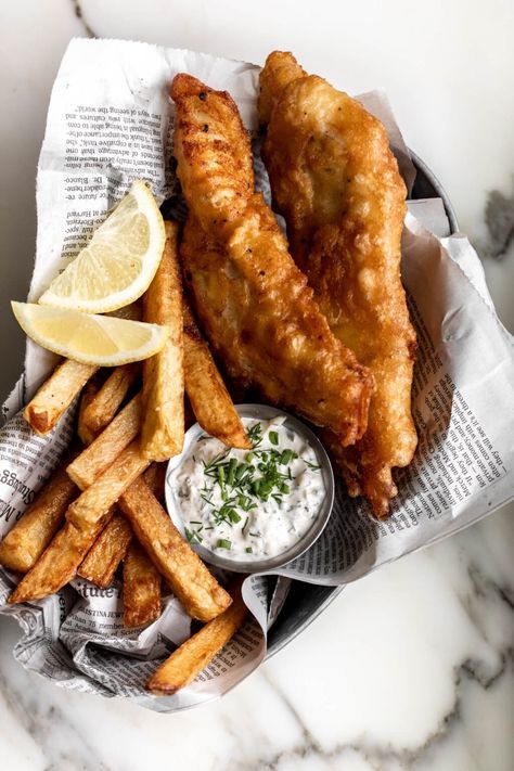 fish and chips in a bowl with lemon wedge and fries Battered Fish And Chips, Fish And Chips Recipe, Fish N Chips Recipe, Beer Battered Fish, Battered Fish, Pub Food, Beer Batter, Chips Recipe, British Food