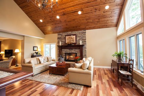 Another view.  Tonge & groove ceiling.  Large chandelier.  Cherry flooring. Cherry Wood Ceiling, 1970s Renovation, Pnw House, Cherry Flooring, Classic Family Room, Groove Ceiling, Grand Room, Large Chandelier, Wood Ceiling