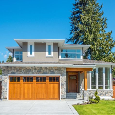 14 Weekend Projects that Add to Home Value | The Family Handyman Garage Door Replacement, Fiberglass Entry Doors, Add Value To Your Home, Wood Garage Doors, Wooden Garage, Brick And Wood, Roof Colors, Craftsman Bungalows, Home Renovations