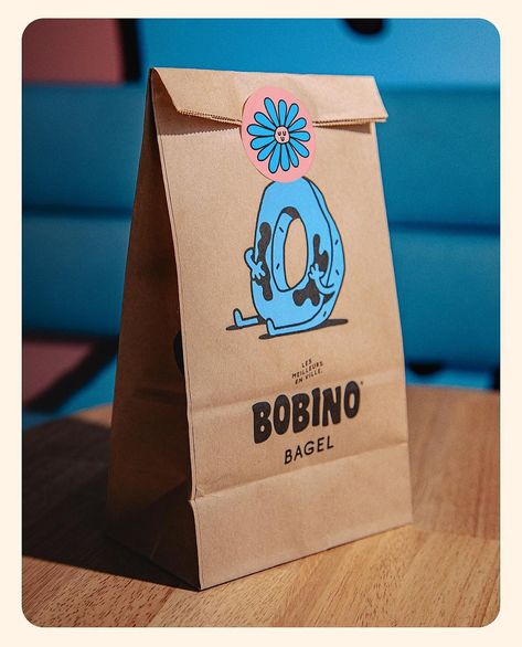 @orkestra37 - BOBINO BAGEL — You know, we’re always the type to have bread on the board. But here we have bagels too. 🥯 Orkestra is… | Instagram Bagel Branding Design, Bagel Branding, Bagel Logo, Bagel Packaging, Bread Character, Baked Bagels, Cookies Logo, Bagel Bar, Roti Bakar