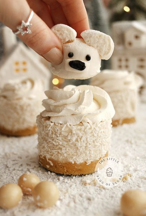 Hand placing a marshmallow polar bear on top of a mini coconut cheesecake. Polar Bear Cheesecake, Polar Bear Treats, Christmas Marshmallow Ideas, Holiday Cheesecake, Individual Cheesecakes, Coconut Icing, Dairy Free Treats, Vanilla Marshmallows, Coconut Cheesecake