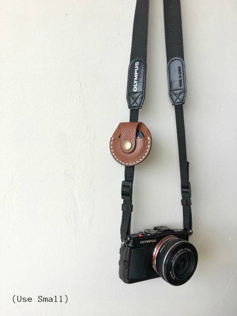 Leather Camera Lens Cap Holder Lens Cap Holder | Etsy Diy En Cuir, Cap Holder, Leather Camera Strap, Lens Caps, Leather Camera Bag, Leather Scraps, Camera Straps, Initial Name, Photography Accessories