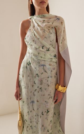 Find GIVENCHY Draped Floral Silk Maxi Dress Fr 38 on Editorialist. Informed by the delicate flowers depicted in Hubert de Givenchy’s archives; the French house’s Spring collection delivers diaphanous; all-occasion dresses; separates; and more.Cut from sheer silk-georgette printed with irises (a signature from this season); this floor-grazing style drapes over the body so gracefully and cascades along the open back. Givenchy Dress, Luxurious Dresses, Silk Maxi, Couture Designers, Delicate Flowers, Versatile Outfits, Silk Maxi Dress, French House, Draped Dress