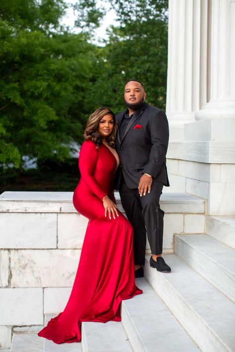 Engagement Photos With Red Dress, Black And Red Engagement Photos, Red Dress Couple Photoshoot, Engagement Photos Red Dress, Red Engagement Dress, 40th Photoshoot, Black Couple Outfits, Grooms Suits, Engagement Photo Shoot Poses