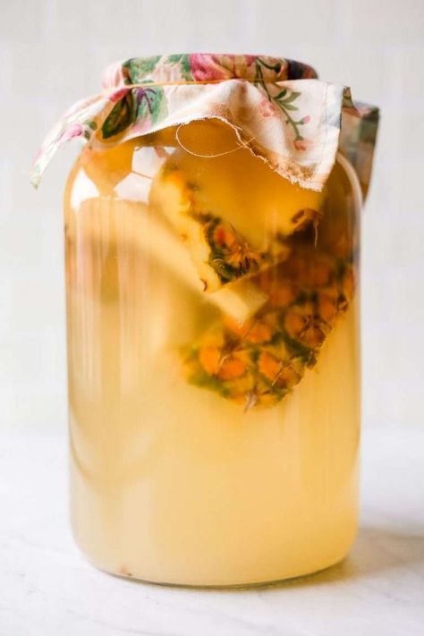 My easy pineapple vinegar recipe requires only four ingredients: pineapple scraps, sugar, raw vinegar for a starter culture, and water. This is the perfect recipe to use up pineapple scraps. Pineapple Vinegar Recipes, Pineapple Scraps, Pineapple Vinegar, Homemade Vinegar, Fruit Vinegar, How To Make Vinegar, Fire Cider Recipe, Kombucha Scoby, Green Tomato Recipes