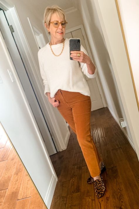 une femme d'un certain age | A casual holiday outfit for Thanksgiving #holidayoutfit #falloutfit #cashmere #over40style #athomeholiday Casual Mustard Sweater For Fall, Chic V-neck Sweater With Ribbed Cuffs For Fall, Women’s Thanksgiving Day Outfit, Casual Thanksgiving Outfits, Corduroy Pants Outfit, Casual Thanksgiving Graphic T-shirt, Casual Thanksgiving Graphic Print T-shirt, Pants Outfit Fall, Casual Holiday Outfits