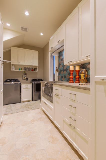 Cabinet Above Sink, Transitional Laundry Room, Grey Laundry Rooms, Laundry Room Lighting, Recessed Panel Cabinets, Laundry Space, Laundry Room Renovation, Lakeside Living, Travertine Floors