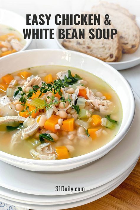 This Chicken and White Bean Soup is a comforting, healthy bowl of deliciousness. Simple to make in 30 minutes, it's filled with a handful of wholesome ingredients and tender chicken. It's an easy meal to warm up with on chilly days! Chicken White Bean Stew, Chicken And Beans Soup, White Bean Soup With Chicken, White Bean And Chicken Soup, Chicken And White Beans Recipe, Soup With Chicken Thighs, Chicken And Bean Soup, Chicken Bean Soup, Chicken White Bean Soup