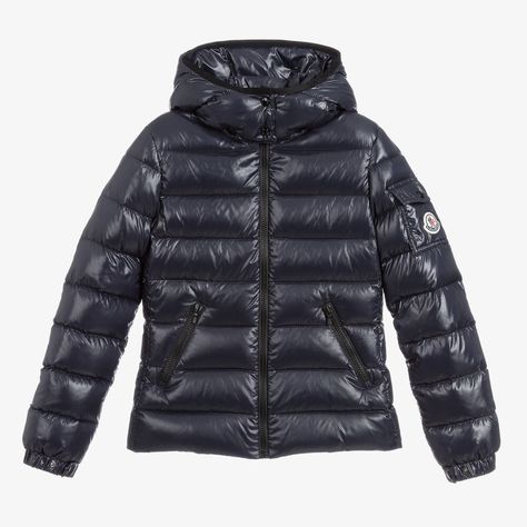 Teen girls navy blue puffer jacket by luxury designer Moncler Enfant, with a glossy finish. This water repellent piece is stamped with the iconic felt logo badge on the sleeve pocket, adding instant brand awareness to this practical outerwear style. Padded with down for cosy warmth, it has a detachable, popper fastening hood for added versatility. There is a smooth zip fastening on the front and zip pockets, both trimmed with black piping for a contrasting, stylish finish. Moncler Jacket Women, Cute Winter Coats, Stylish Winter Coats, Blue Puffer Jacket, Blue Puffer, Stylish Blazer, Moncler Jacket, Logo Badge, Stockholm Fashion