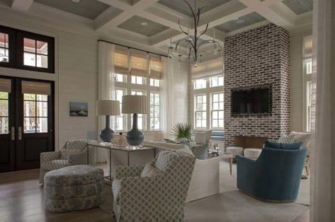 Tour this dreamy Florida beach house with must-see details Behind Sofa Table, Red Brick Fireplaces, Shade Curtain, Beach House Tour, Chic Beach House, Florida Beach House, Behind Couch, Gourd Lamp, Cottage Living Rooms