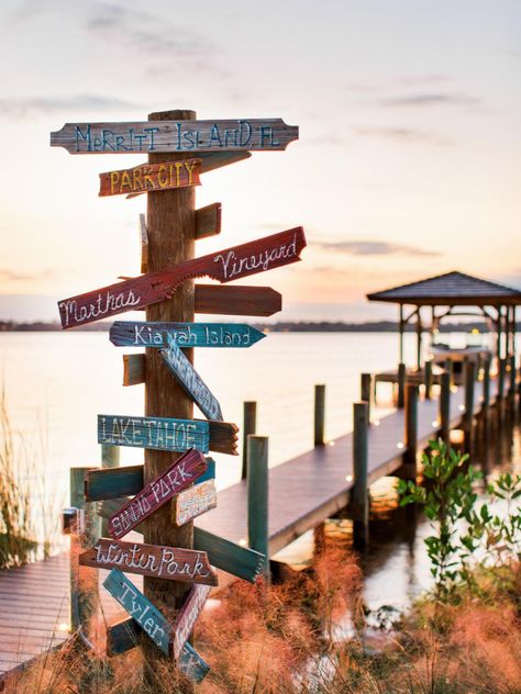 Designer David Bromstad created a focal point art piece for the dock directing visitors to points of interest. Florida Coastal Decor, Focal Point Art, Point Art, Hgtv Dream Homes, Boat Docks, Lake Dock, Lakefront Living, Hgtv Dream Home, Lake Decor