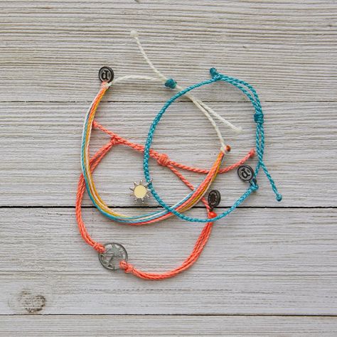 This Set From Pura Vida Comes With Three Bracelets; A Turquoise Mini Braided Bracelet With A Silver + Yellow Sun Charm, An Orange Multi-String Bracelet With An Antique Silver Palm Tree Charm, And A Classic Pura Vida String Bracelet In Vibrant Summertime Colors. Nwot: The Item Is In Perfect Condition - 100% Waterproof - Wax Coated - Adjustable From 2-5 Inches In Diameter Please Reach Out With Any Questions On This Item! . Bundle + Save! Enjoy 15% Off When You Purchase Two Or More Items From My Closet Bohemian | Festival | Concert | Spring Break | Summer | Beach | Vacation | Sun | Surf | Swim | Water | Summertime | Athleisure | Yoga Pura Vida Charm Bracelets, Summertime Athleisure, Cute Pura Vida Bracelets, Pura Vida Bracelets Aesthetic, Pura Vida Bracelets Diy, Slay Bracelets, Beachy Jewelry Pura Vida, Pura Vida Bracelets Set, Yellow Pura Vida Bracelet