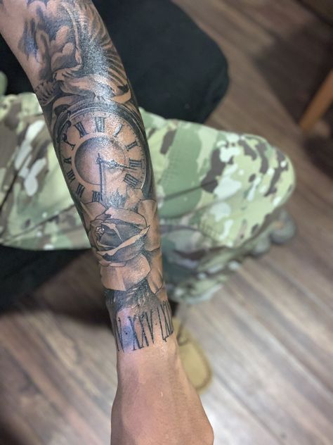 Men Outer Forearm Tattoos, Tatoos Men Fore Arm, Forearm Tattoo Men Sleeve Meaningful, Male Half Sleeve Tattoo, Roman Numeral Tattoo Men Forearm, Men Forearm Tattoos Sleeve, Outer Arm Tattoo Men, Best Forearm Tattoos For Men Ideas, Sleeve Filler Ideas Men Arm Tattoo