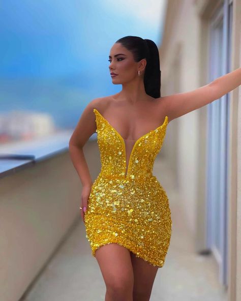 Share this look with a friend who would rock this stunning dress! To order this radiant yellow mini dress, send us a DM at @reineecouture. This breathtaking mini dress is the epitome of glamour and bold elegance. Drenched in a vibrant yellow hue, it features a plunging neckline that beautifully highlights the décolletage, adding a touch of daring sophistication. The dress is embellished with an array of sparkling sequins and crystals that catch the light with every movement, creating a show-... Long Homecoming Dress, Yellow Mini Dress, Homecoming Dresses Long, A Line Shorts, Short Homecoming Dress, Custom Size Dresses, Outfit Dress, Homecoming Dress, Stunning Dresses