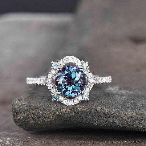 14K White Gold Halo Engagement Ring - 1.20 CT Round Cut Alexandrite Ring - Alexandrite Halo Anniversary Ring - Vintage Art Deco Women's Ring ❥Ring Details : ------------------- Product Type : Ring Metal : 925 Sterling Silver, 10k, 14k, 18k Metal Finish : Highly Polished Diamond Setting : Halo Setting Ring Size : 4-13 US (Select From Option) ❥Main Stone Details : Main Stone: Lab Created Alexandrite Shape: Round Stone Weight: 1.20 CT Measurement: 6.5 mm Color: Purple, Blue Clarity: VVS1 ❥Side Ston Diamond Sapphire Engagement Ring, Sapphire Diamond Engagement, Moissanite Engagement Ring Halo, Yellow Engagement Rings, Alexandrite Engagement Ring, Alexandrite Ring, Deco Engagement Ring, 19 Days, White Gold Engagement