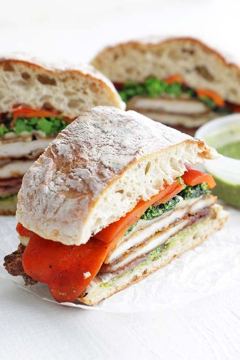 This Chicken Cutlet Sandwich Recipe features breaded chicken, broccoli rabe, prosciutto, and roasted peppers for the ultimate sandwich. Broccoli Rabe Sandwich, Chicken Cutlet Sandwich, Cutlet Sandwich, Prosciutto Sandwich, Ultimate Sandwich, Billy Parisi, Chicken Saltimbocca, Chicken Cutlet, Oven Roasted Tomatoes