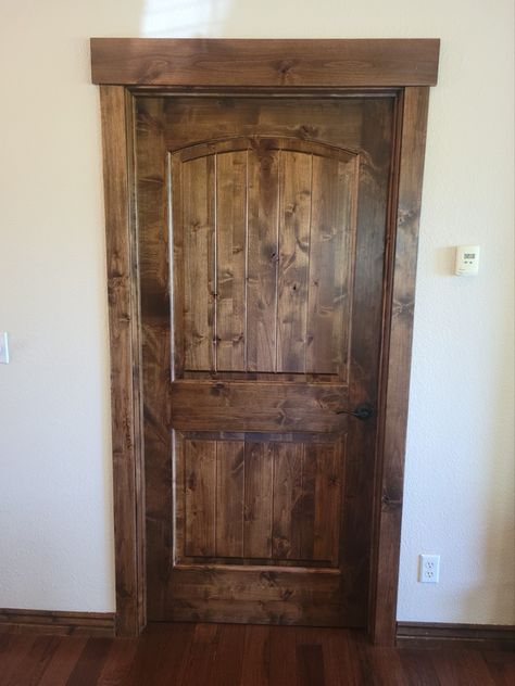 Cabin Interior Doors And Trim, Rustic Wood Trim Ideas, Stained Bedroom Doors, Knotty Alder Trim And Doors, Black Interior Doors With Wood Trim, Wood Trim Colors, White Trim Wood Doors, Rustic Door Trim, Stained Interior Doors