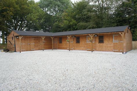 This stable block includes three stables, corner box, tack room and hay barn. The overhang was extended to 1.5m to provide additional protection from the elements. As standard, overhangs greater than 1.2m include support posts and curved angles braces. Stable Layouts, Stable Inspiration, Horse Stables Design, Dream Barn Stables, Stable Yard, Equestrian Barns, Equestrian Stables, Stable Block, Equestrian Building