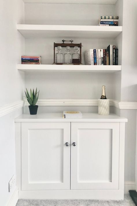 Alcove cupboard installed each side of the fireplace in the lounge of a Victorian property in SW London. Each cupboard has recessed panel doors - a modern take on a traditional style - made from EU approved quality, water resistant MDF. Using the latest technology in Computer Aided Manufacturing (CAM) from our associates at Jali, automated spraying techniques and eco friendly paints, this fitted furniture is made to measure and built to last. #FittedFurniture #Storage #Cupboard #Alcove Victorian Conversion, Alcove Ideas Living Room, Living Room Cupboards, Alcove Storage, Alcove Cupboards, White Cupboards, Recessed Cabinet, Built In Shelves Living Room, Simple Living Room Decor