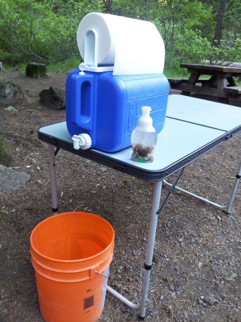 Hand Washing & Water Refill Station for camping!  Doubles as washing hands and also for kids to quickly get a refill of water.  This was the bomb! The spout was easy for kids, and put clean rocks in foam soap so it never got knocked over (and some leaf confetti :-) the bucket of course, so no muddy mess! Camping Hand Washing Station, Camping Wash Station, Refill Station, Camping Supply List, Camping Bathroom, Leaf Confetti, Hand Washing Station, Washing Hands, Diy Camping