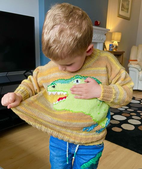 I decided to hunt for dinosaur jumper patterns as my grandson has just discovered them. He, like so many before him, can name a good selection. He chose the pattern from the ones I found as his favourite dinosaur is a T Rex. He requested yellow. Fortunately a great opportunity for using a few balls from my stash. Dinosaur Jumper, Dinosaur Sweater, Knitting Patterns Free Sweater, Jumper Knitting Pattern, Jumper Patterns, My Grandson, Cross Stitch Supplies, Dinosaur Pattern, Red Heart Yarn