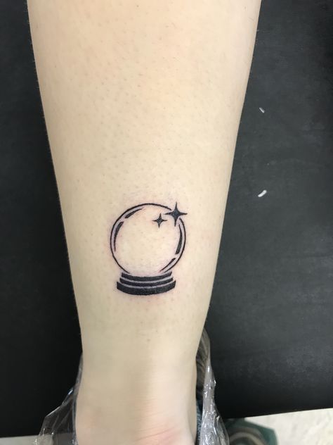 Fortune Ball Tattoo, Small Crystal Ball Tattoo, Crystal Ball Tattoo Ideas, Magic Ball Tattoo, Snow Globe Tattoo, Small Witchy Tattoos, Crystal Tattoo Ideas, Spark Tattoo, Crystal Ball Tattoo