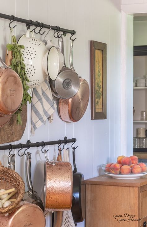 simple and thrifty hanging pot rack Kitchen Pan Rack, Display Copper Pots In Kitchen, Pans Hanging On Wall, Pots And Pans Wall Storage, Copper Pot Display, Hanging Pans On Wall, Pan Holder Diy, How To Hang Cast Iron Skillets On Wall, Kitchen Hooks Decor