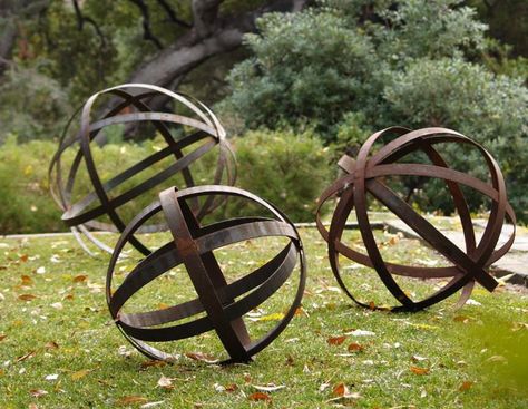 Rusted Iron Spheres  The Rusted Iron Spheres are available in three sizes: 18, 24, and 36-inches in diameter, starting at $145 at Potted. Corten Steel Garden, Garden Spheres, Unique Garden Art, Decorative Spheres, Metal Garden Art, Unique Gardens, Wine Barrel, Garden Crafts, Garden Ornaments