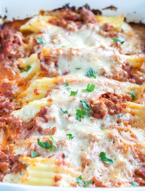 Stuffed Manicotti with Sausage - Food Lovin Family Stuffed Manicotti Alfredo, Manicotti Recipe Sausage, Stuffed Manicotti With Meat, Sausage Stuffed Manicotti, Sausage Manicotti Recipe, Italian Sausage Sauce, Sausage Manicotti, Stuffed Manicotti Recipe, Meat Manicotti