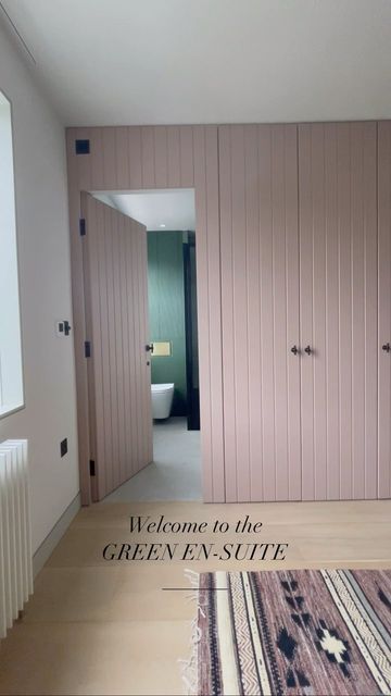 Ensuite Dressing Room, Concealed Bathroom Door Wardrobe, Built In Wardrobe Over Door, Wardrobe And Ensuite Ideas, Reeded Wardrobes, Pink Built In Wardrobe, Bedroom And Ensuite Ideas, Walk Through Wardrobe To Ensuite, Ensuite And Walk In Wardrobe