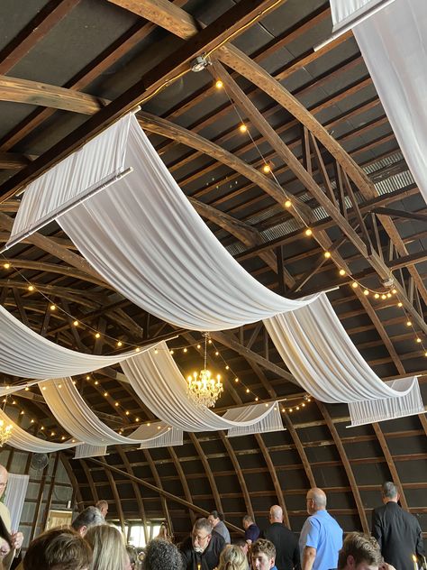 Draped Ceiling Wedding, Wedding Reception Ceiling, Wedding Ceiling Draping, Barn Party Ideas, Wedding Venue Design, Ceiling Swag, Reception Ceiling, Diy Drapes, Ceiling Drapery