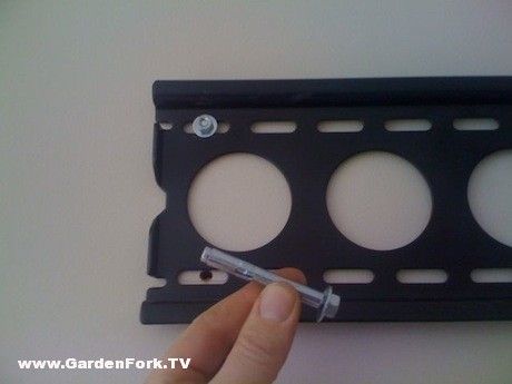 Hang a TV on a brick or concrete wall Mounting Tv On Concrete Wall, Brick Wall Diy, Concrete Walls Diy, Tv Above The Fireplace, Concrete Basement Walls, Eclectic Diy, Stone Fireplace Wall, Above The Fireplace, Tv Mounted