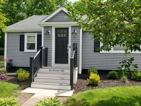 Mastic Vinyl Siding in Deep Granite has given this New Bedford, MA homeowner peace of mind with a low maintenance exterior. #NewBedfordMA #MasticVinylSiding #Carvedwood44 #clapboard #clapboardsiding #graysiding #vinylsiding #siding #Mastic #PLYGEM #sidingcontractor #homeimprovement #contractor #blackdoor #deepgranite #southcoast Light Gray Vinyl Siding House, Deep Granite Vinyl Siding, Light Grey Vinyl Siding House, Mastic Vinyl Siding, Grey Vinyl Siding, Vinyl Siding House, Exterior House Siding, Grey Siding, Clapboard Siding