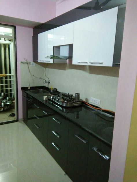 Straight modular kitchen Black & white color, wall unit  Covers for Chimney pipe, Wall cabinet, Swaras  kitchen interior. Chimney Covering Ideas, Kitchen Unit Designs, Kitchen Wall Units, Kitchen Chimney, Kitchen Unit, Kitchen Ideals, Kitchen Black, Kitchen Interior Design Decor, Color Wall