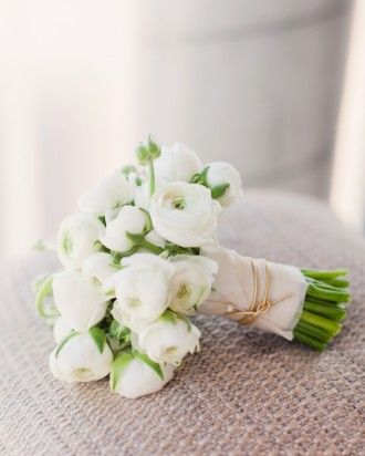 RANUNCULUS BOUQUET  The bridal bouquet consisted of white ranunculus and was finished with gold cord around the stems. Bouquet Pastel, Ranunculus Bouquet, Fall Barn Wedding, White Ranunculus, Restaurant Wedding, Martha Stewart Weddings, Boracay, Bride Bouquets, Bridal Flowers