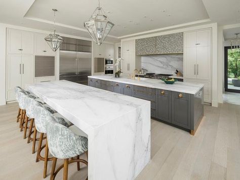 Calcutta Marble Waterfall Kitchen Island with Blond Wood Floors Calcutta Marble Kitchen, Waterfall Island Kitchen, Double Island, Double Island Kitchen, Contemporary Style Kitchen, Almirah Designs, White Marble Kitchen, Island Countertops, Kitchen Island With Seating