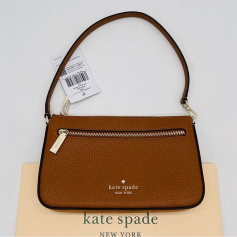 Brand New With Tag Kate Spade Leila Convertible Wristlet Pochette With Zip-Top Closure Details Color: Warm Gingerbread 4.5" H X 7.25 W X 1.25" D Pebbled Leather Ksny Metal Pinmount Logo Two Way Spade Jacquard Lining Interior: 6 Credit Card Slots, 1 Slip Pocket Front Zip Pocket Shoulder Strap Doubles As Wristlet Strap Kate Spade Logo Fits Current Iphone Kate Spade Logo, Spade Logo, Zip Top, Brown Gold, Pebbled Leather, Card Slots, Convertible, Slots, Gingerbread