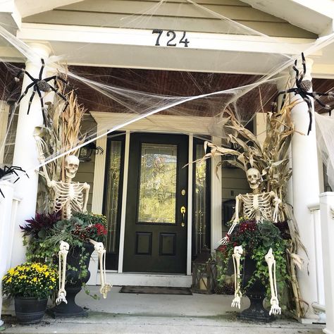 Halloween Spider Porch Decorations, Fall Decor Ideas For The Porch Skeleton, Front Door Skeleton Decor, Skelton On Front Porch, Halloween Urn Ideas, Life Size Skeleton Decor, Halloween Porch Pillar Decorations, Skeletons On Porch, Halloween Porch Decorations Diy Classy