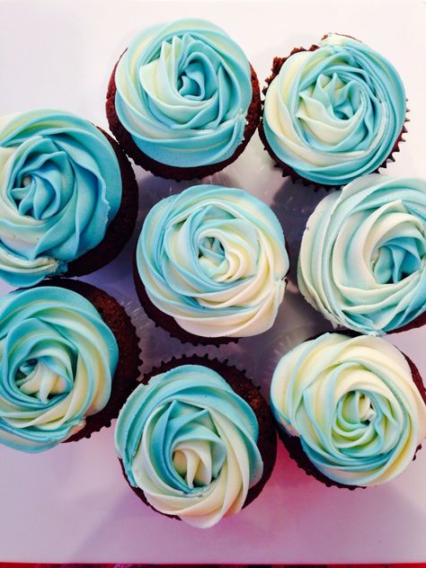 Blue rose swirl cupcakes with an attempt at two tone icing! Blue And White Swirl Cupcakes, Blue Themed Cupcakes, Baby Boy Shower Cupcake Ideas, 1st Birthday Cupcakes For Boys, Blue Icing Cupcakes, Blue Frosting Cupcakes, Blue Rose Cupcakes, Light Blue Cupcakes, Blue Birthday Cupcakes