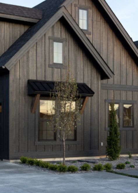 Wooden Farmhouse Exterior, Wood Board And Batten Exterior, Brown Siding With Black Windows, Rustic Modern Architecture, Black Metal Building With Wood Accents, Farmhouse Exterior Dark, Black Stained Cedar Siding, Dark Brown Siding Exterior, Pine Siding Exterior