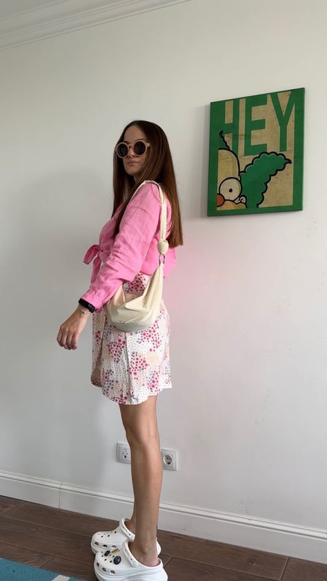 Sharing my outfits: Outfit for Barbie movie 💕 Pink linen shirt, floral mini skirt, Crocs Bae Clog, crossbody bag, round glasses #ootd #ootdfashion #streetstyle #fashion #lookoftheday #outfits #outfitideas #barbie #style #stylish #styleblogger #styleideas Crocs With Skirt Outfit, Crocs Pink Outfit, Skirt With Crocs, Crush Crocs Outfit, Orange Crocs Outfit, Crush Clog Outfit, Crocs Siren Clogs Outfit, Crocs Mega Crush Clog Outfit, Outfit For Barbie Movie