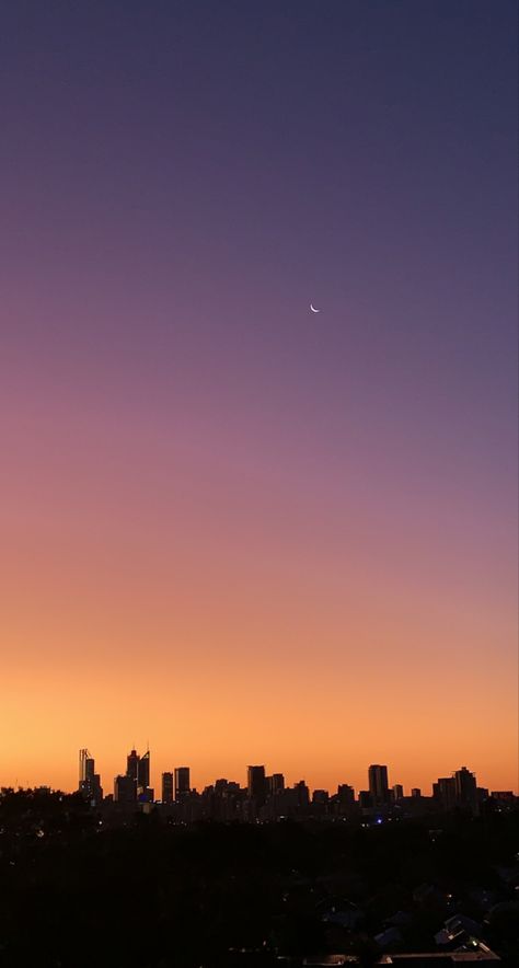 City scape with sunset going from blue, purple, pink, orange, yellow gradient. Moon in right hand corner. City Sunset Aesthetic, Sunrise City, Pretty Views, City Sunset, God's Glory, City Of God, Beautiful Flowers Photography, Sky Wallpaper, Sunset Background