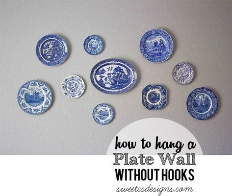 How to hang a plate wall without hooks- an easy tip to decorate your home without ugly plate hooks! Blue Plates Wall, Plate Wall Display, White Lace Curtains, Bathroom Decor Themes, Painting Ceramic Tiles, Plate Hangers, Plates Diy, Bathroom Themes, Plate Wall