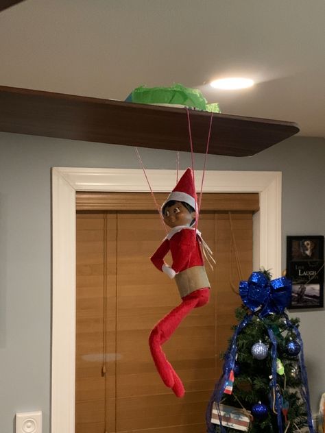 Elf on shelf parachute jumping onto fab. Elf On Shelf Parachute, Elf On The Shelf Parachute, Elf Parachute, Funny Elfs, Parachute Jumping, Elf 2023, Elf Classroom, Elf Games, Elf On Shelf