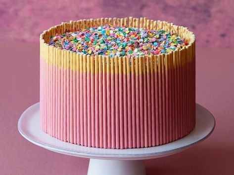 Strawberry Pocky Stick Cake Recipe | Food Network Kitchen | Food Network Pocky Cake, Pocky Strawberry, Pocky Sticks, Measuring Flour, Dry Measuring Cups, Pink Frosting, Strawberry Cakes, Gel Food Coloring, Thanksgiving Ideas